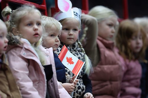 Two-year-old Winkler from Brandon holds a Canadian maple leaf flag while waiting for the Canine Circus performance to begin on Monday evening at the Westoba Place Arena during the opening night of the Royal Manitoba Winter Fair. (Matt Goerzen/The Brandon Sun)