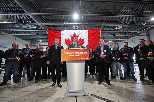 Workers at the Maple Leaf Foods plant in Brandon flank Manitoba Premier Wab Kinew and Manitoba Agriculture Minister Ron Kostyshyn during a Wednesday afternoon announcement of $10.7 million in added support for Manitoba producers. (Matt Goerzen/The Brandon Sun)