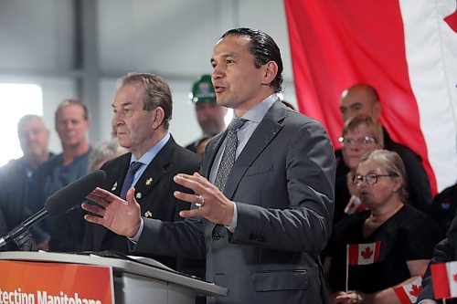 Premier Wab Kinew gestures while speaking with reporters at the Maple Leaf Foods plant on Wednesday afternoon, following his announcement of $10.7 million in added support for Manitoba producer. (Matt Goerzen/The Brandon Sun)
