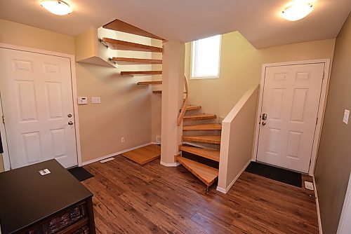 Todd Lewys / Free Press
Centred around a striking open-riser spiral staircase, the roomy foyer also comes with a walk-in closet, storage closet and door that provides access to a fully insulated attached double garage.