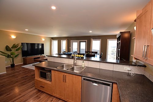Todd Lewys / Free Press
A glass-filled rear wall allows tons of natural light to flow freely into the warm, inviting main living area.