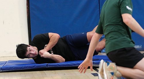 George Vorster, shown during a drill focused on using neck muscles to fall without hitting his head on the ground, is headed to British Columbia to play semi-professional rugby after high school. (Thomas Friesen/The Brandon Sun)