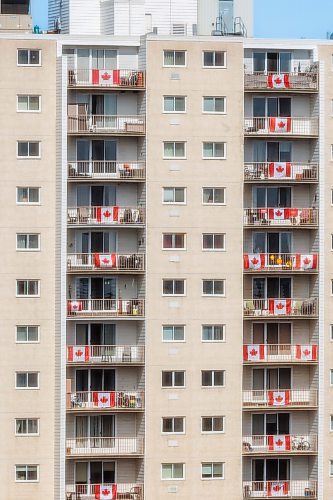 MIKE DEAL / FREE PRESS
Dozens of Canadian flags hang from the apartment balconies at The Chateau Guay on Goulet Street on Friday.
Standup
250411 - Friday, April 11, 2025.