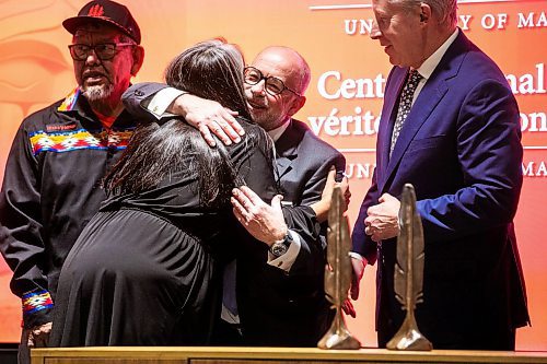 MIKAELA MACKENZIE / FREE PRESS
Paul Genest, senior vice president of Power Corporation of Canada, hugs Stephanie Scott, executive director of the National Centre for Truth and Reconciliation (NCTR), at an event announcing a gift of two million dollars from Canada Life and Power Corporation for the building of a permanent location for the NCTR on Tuesday, April 15, 2025.
For Scott story.
Winnipeg Free Press 2025