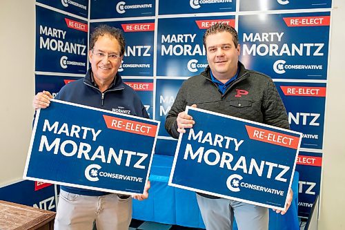 BROOK JONES/FREE PRESS
Incumbent Conservative candidate Marty Morantz (left) and his campaign manager Michael Kowalson hold re-elect campaign lawn signs while standing inside the campaign office at 9-3421 Portage Ave. in Winnipeg, Man., Thursday, April 17, 2025. Morantz, who is a two-term Conservative incumbent, is running in the federal riding of Winnipeg West.