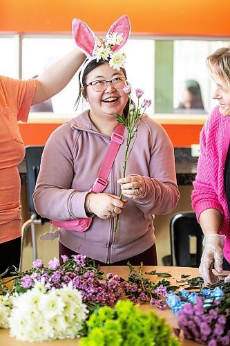 MIKAELA MACKENZIE / FREE PRESS
	

Garden City Collegiate adult transition program student Sophia Ly (20) has fun with the flowers while building bouquets on Wednesday, April 16, 2025. Floral wholesaler Petals West has partnered with high schools in north Winnipeg to equip students with disabilities with a regular hands-on learning experience and floral arrangement making skills.

For Maggie story.
Winnipeg Free Press 2025