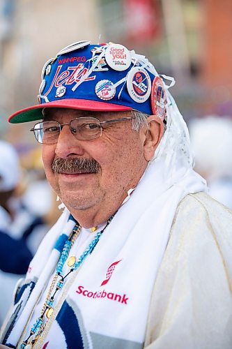 BROOK JONES/FREE PRESS
Winnipeg Jets fan John Couture, 73, shows off his collection of Jets buttons from over the years during Game 1 of the National Hockey League Stanley Cup playoff between the hometown Winnipeg Jets and the visiting St. Louis Blues as he attends the Winnipeg Jets Whiteout party on Donald Street in Winnipeg, Man., Saturday, April 19, 2025.