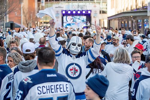 BROOK JONES/FREE PRESS
Jets fan Mike Holmes, 39, wears a Darth Vader helmet painted white and a Jets jersey during Game 1 of the National Hockey League Stanley Cup playoff between the hometown Winnipeg Jets and the visiting St. Louis Blues as he attends the Winnipeg Jets Whiteout party on Donald Street in Winnipeg, Man., Saturday, April 19, 2025.