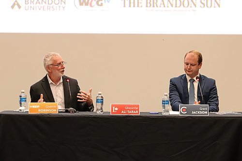 Brandon-Souris NDP candidate Quentin Robinson (left) makes a point while Conservative candidate Grant Jackson listens during the all-candidates’ debate at Brandon University on Wednesday. A place was kept for Liberal candidate Ghazanfar Ali Tarar, but he did not attend, citing a family medical emergency. (Liam Pattison/The Brandon Sun)