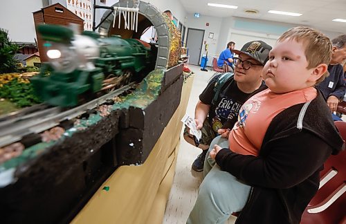 JOHN WOODS / FREE PRESS
Rob, left, and his son Alex check out the train displays at the Winnipeg Model Railroad Club’s annual open house at the Charleswood Legion Hall Sunday, April 27, 2025. 

Reporter: standup