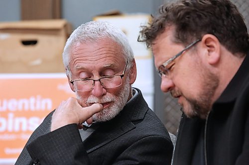 Brandon-Souris federal NDP candidate Quentin Robinson watches poll results with Glen Simard, Brandon East NDP MLA and Manitoba's minister of municipal and northern relations, on Monday night at the Brandon and District Labour Council office on Rosser Avenue. (Matt Goerzen/The Brandon Sun)