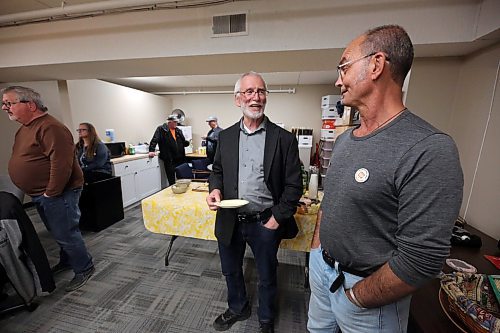 Brandon-Souris federal NDP election candidate Quentin Robinson speaks with Brandon East NDP provincial constituency association president Clark Marcino on Monday night at the Brandon and District Labour Council office on Rosser Avenue. (Matt Goerzen/The Brandon Sun)