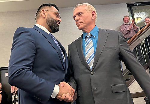 STEVE LAMBERT / Winnipeg Free Press
Obby Khan (left) shakes hands with Wally Daudrich after winning the leadership of the Progressive Conservative Party of Manitoba in Winnipeg on Saturday.