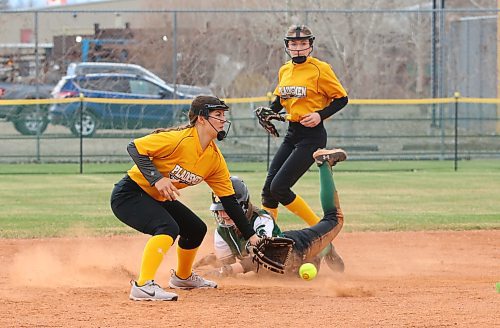 Neelin Spartans base runner Ella Kulchyski slides head first into second base safely as Grace Mohr-Clark of the Crocus Plainsmen gathers in the ball and Quinlan Richard looks on during the second inning of her team's 19-0 victory over the Crocus Plainsmen on Thursday afternoon at Ashley Neufeld Softball Complex. (Perry Bergson/The Brandon Sun)
