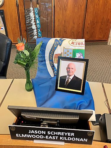JOYANNE PURSAGA / FREE PRESS
Items were placed at the council chamber desk of late Elmwood-East Kildonan councillor Jason Schreyer before a meeting Friday.