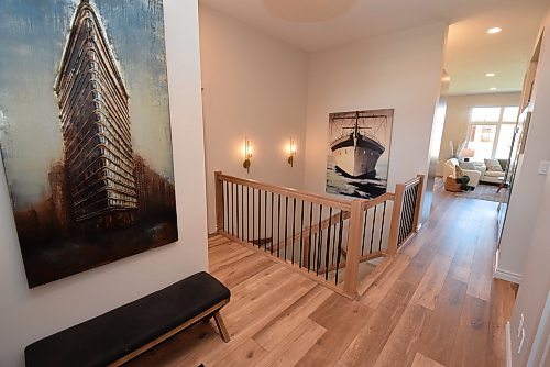 Todd Lewys / Free Press
Rich walnut-style laminate plank flooring endows the home with a welcoming sense of warmth the instant you step inside.