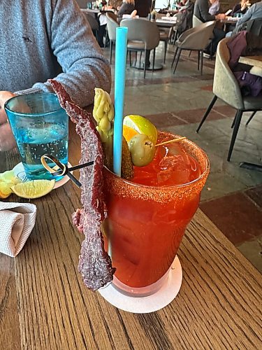 Katrina Clarke / Free Press
Enjoy a virgin Caesar complete with a giant slice of beef jerky in Jasper Park Lodge’s Emerald Lounge, where views the Rocky Mountains out floor-to-ceiling windows are stunning. 