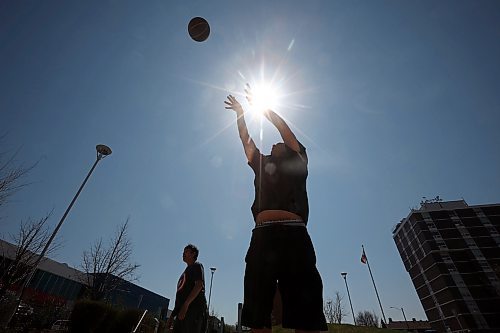 Conrad Bone takes a shot on net while shooting hoops with friends in front of the Brandon YMCA on Princess Avenue in Brandon on Monday afternoon. (Tim Smith/The Brandon Sun)