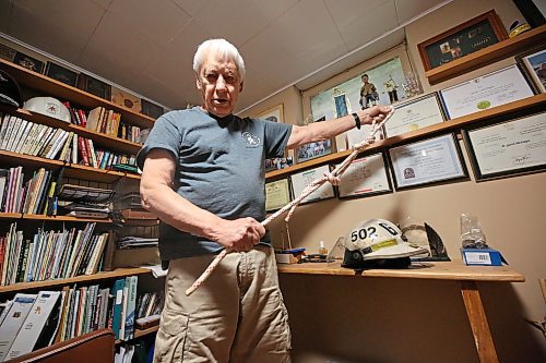 Retired Glenboro firefighter and first responder Garth McIntyre demonstrates one of the many knots that volunteer firefighters are required to learn as part of their training. (Matt Goerzen/The Brandon Sun)