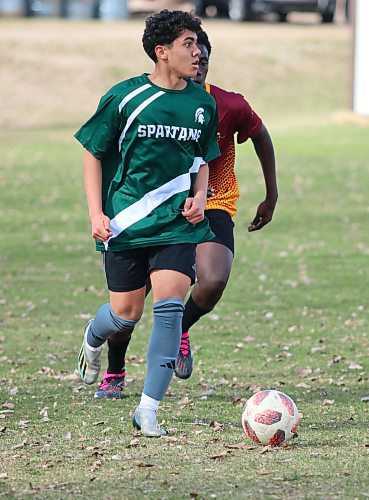 Robinson Diaz Rengifo looks to find an open teammate in a recent Brandon high school boys soccer game. (Matt Packwood/The Brandon Sun)