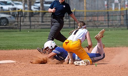 Westman Magic shortstop Mya Duncan-Gagnon tries to tag a Winnipeg Lightning base runner out at second, but the slide rips her glove off and the runner is called safe during their U17 softball game at Ashley Neufeld Softball Complex on Saturday. (Thomas Friesen/The Brandon Sun)