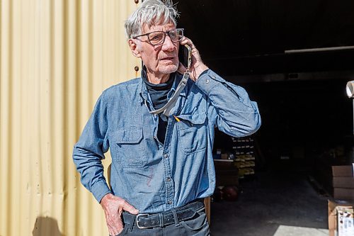 MIKE DEAL / FREE PRESS
Al Thompson owner of Thompson Rink Equip at 592 Gunn Rd, on the phone while waiting for insurance adjusters after a grassfire damaged his building and ravaged several other businesses in North Transcona on Monday.
Reporter: Nicole Buffie
250513 - Tuesday, May 13, 2025.