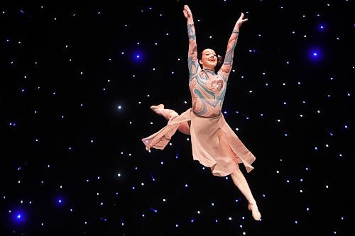 16052025
Mila Yuel leaps through the air while performing in the 
Competitive - Senior - Lyrical - 15 - Solo category during the second day of the Entertain Us Dance Competition at the Western Manitoba Centennial Auditorium on Friday. 
(Tim Smith/The Brandon Sun)