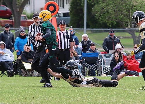 Saskatchewan's Elias Kellington of Melfort (10) shakes of a tackle by Manitoba's Spencer Hill of Moosomin (34) during the first quarter in the fifth edition of the annual Sask-Toba Challenge Cup at Neelin on Monday. (Perry Bergson/The Brandon Sun)
May 20, 2025
