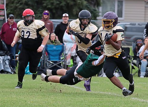 Manitoba running back Fola Fashola of Virden (14) evades a Saskatchewan tackle attempt in the fifth edition of the annual Sask-Toba Challenge Cup at Neelin on Monday. (Perry Bergson/The Brandon Sun)
May 20, 2025