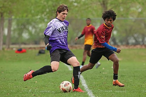 Calen Sass of the Vincent Massey Vikings moves the ball past Zeresenai Hadish of the Crocus Plainsmen during the Brandon High School Soccer League boys final at Crocus Plains on Wednesday.
(Tim Smith/The Brandon Sun)