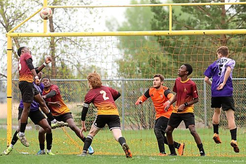 21052025
Ben Ibitoye #15 (L) of the Crocus Plainsmen heads the ball in front of the Vincent Massey Vikings goal during the high school boys soccer final at Crocus Plains Regional Secondary School on Wednesday.
(Tim Smith/The Brandon Sun)