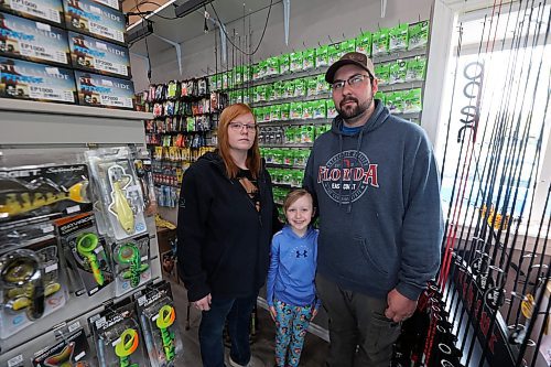 Eric Evans, his wife Jaylene and their daughter Danica stand in their bait shop E&J Live Bait at Pelican Lake. The family says they expect to be financially impacted as the new boat policy from RM of Prairie Lakes may reduce tourism. The Evans sell fishing equipment and collect boat launch fees. They said they saw a decrease in boats since last year, where roughly 60 boats came for the opening of walleye fishing season in 2024, and just five came in 2025. (Connor McDowell/Brandon Sun)