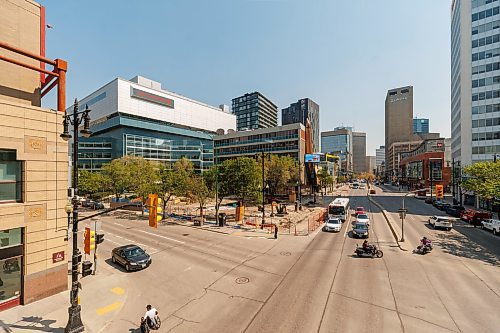 MIKE DEAL / FREE PRESS
A view looking east from the skywalk over Portage Avenue at Carlton Street of the Air Canada Window Park that is under construction.
Visible signs that True North is making progress on the redevelopment of Portage Place Shopping Centre have arrived and soon access to the building will be shifted to allow for the removal of the Clocktower atrium. The main mall area will still be accessible, including access to Prairie Theatre Exchange, but the main access from Portage Avenue will move to the entrance at Portage and Kennedy Street. The entrances at Portage and Edmonton and Portage and Carlton will be closed as well as the skywalk at the Carlton Street intersection. The Parkade entrance and exit on Carlton will be closed. These changes will start in July and continue for three years.
Reporter: Malak Abas
250526 - Monday, May 26, 2025.