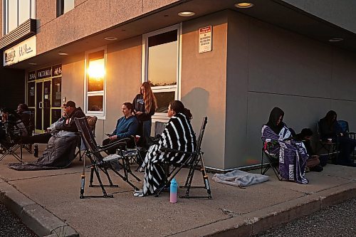 28052025
Sophie Drohan styles her mom Leslie’s hair while passing time in line outside the doors of Guild Insurance Group on Victoria Avenue at sunrise early Wednesday morning. The Drohan’s arrived at 4:30AM to secure a spot in line in hopes of registering Sophie for the Driver Z provincial driver's education program. The line of students and parents wrapped around two sides of the building, with many having arrived overnight. There were also lines at Westland Insurance and Western Financial Group. Many parents and teens are frustrated that Manitoba Public Insurance is not meeting the demand for the program.
(Tim Smith/The Brandon Sun)