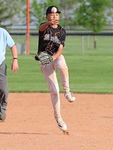 Marlins shortstop Madden Cheung throws to first for an out in the second inning of his team's win. (Matt Packwood/The Brandon Sun)