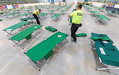 MIKE DEAL / FREE PRESS
Winnipeg Search and Rescue volunteers set up around 100 cots in the Eric Coy Arena, 535 Oakdale Dr, as they assist the Red Cross by setting up facility for them.
Reporter: Tyler Searle
250529 - Thursday, May 29, 2025.