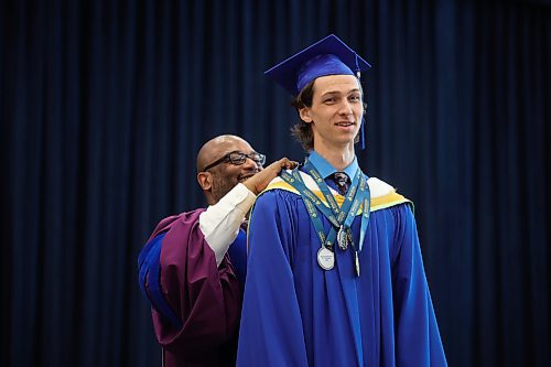 29052025
Bryce Thomas Friesen receives a Brandon University gold medal for the highest standing in his Honours Bachelor of Science program as well as two BU silver medals for Mathematics and Physics and Astronomy while on stage to receive his diploma during Brandon University’s convocation for the Faculty of Science and the School of Music at the BU Healthy Living Centre on Thursday morning. 
(Tim Smith/The Brandon Sun)