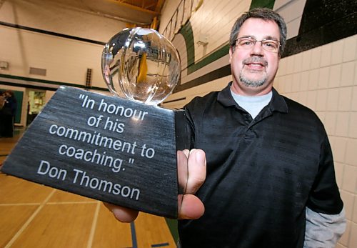 Legacy Brandon Sun 14122007 TIM SMITH/BRANDON SUN Neelin HS Basketball coach Don Thomson displays his Brandon SUN Spartan Invitational Coaching Award after being presented with the award at the Neelin HS gym on Friday.