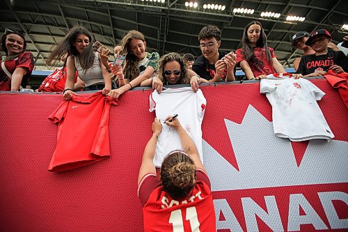 Daniel Crump / Winnipeg Free Press. Desiree Scott (11) signs jerseys for fans following her final international match. The Canadian womenճ national soccer team plays Haiti at Winnipeg Stadium. May 31, 2025.