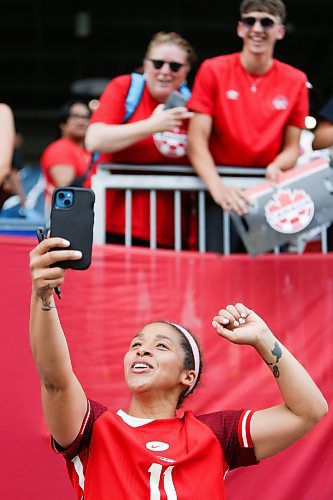 Daniel Crump / Winnipeg Free Press. Desiree Scott (11) takes a selfie with fans following her final international match. The Canadian womenճ national soccer team plays Haiti at Winnipeg Stadium. May 31, 2025.