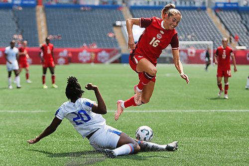 Daniel Crump / Winnipeg Free Press. Canadaճ Janine Sonis (16) and Kethna Louis (20) fight for the ball. The Canadian womenճ national soccer team plays Haiti at Winnipeg Stadium. May 31, 2025.