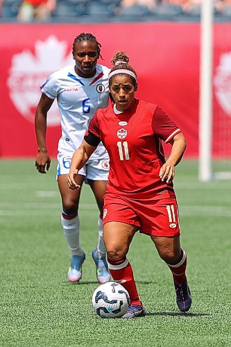 Daniel Crump / Winnipeg Free Press. Team Canadaճ Desiree Scott (11) carries the ball up the pitch as the Canadian womenճ national soccer team plays Haiti at Winnipeg Stadium. May 31, 2025.
