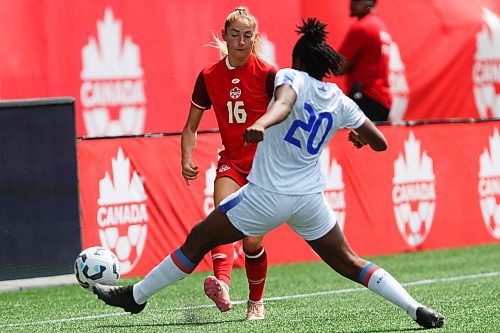 Daniel Crump / Winnipeg Free Press. Canadaճ Janine Sonis (16) and Kethna Louis (20) fight for the ball. The Canadian womenճ national soccer team plays Haiti at Winnipeg Stadium. May 31, 2025.