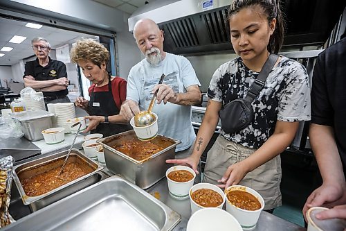 JOHN WOODS / FREE PRESS
Volunteers from St Vital parish and school Ulysse Poirier, from left, Sally Bader, Bob, and Angela Daet, teacher at St Vital School, prepare a meal for fire evacuees who are being housed at Century Arena in Winnipeg Sunday, June 1, 2025.

Reporter: nicole