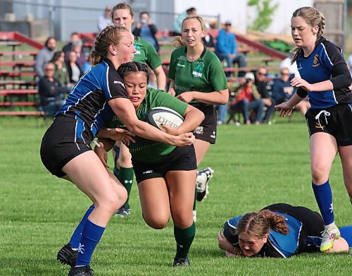 Dauphin Clippers ball carrier Ryann Richard-Soltis puts her head and attempts to push through a tackle by Karas Munz of the Souris Sabres at John Reilly Field on Monday. (Perry Bergson/The Brandon Sun)
June 2, 2025