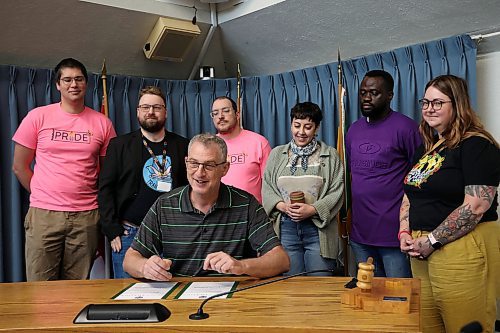 02062025
Brandon Ward 6 Councillor Bruce Luebke, in his role as Acting Deputy Mayor of the City of Brandon, signs a proclamation recognizing June 2025 as Pride Month in the wheat city while joined by Steven Ternovetsky, Derek Booth, Ian Ternovetsky and Han Van De Woestyne with Brandon Pride as well as Friday Olowookere and Kaitlyn White with SERC Brandon. The proclamation was the first in a month of events organized by Brandon Pride.
(Tim Smith/The Brandon Sun)