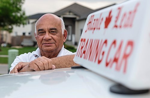 JOHN WOODS / FREE PRESS
Lek Kinnarath, driving instructor and owner of Maple Leaf Driving School, is photographed with his training car in Winnipeg Tuesday, June 3, 2025. 

Reporter: matt