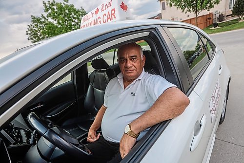 JOHN WOODS / FREE PRESS
Lek Kinnarath, driving instructor and owner of Maple Leaf Driving School, is photographed with his training car in Winnipeg Tuesday, June 3, 2025. 

Reporter: matt