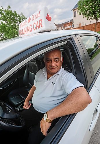 JOHN WOODS / FREE PRESS
Lek Kinnarath, driving instructor and owner of Maple Leaf Driving School, is photographed with his training car in Winnipeg Tuesday, June 3, 2025.
Reporter: matt
