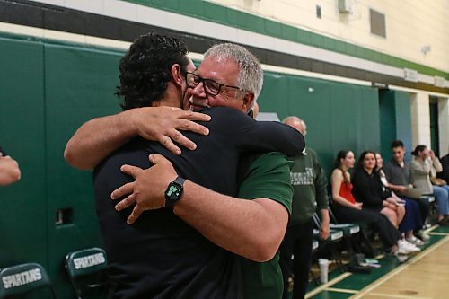 Don Thomson hugs his son Jacob as more than 70 alumni, coaches, friends and family surprised the retiring athletic director at the Neelin Spartans awards night on Tuesday. (Thomas Friesen/The Brandon Sun)